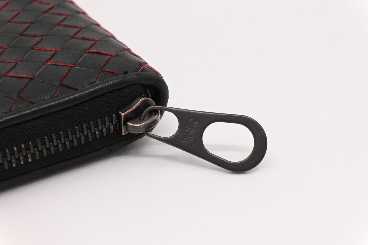 Bottega Veneta Zippy Wallet in Black and Orange Intrecciato Leather