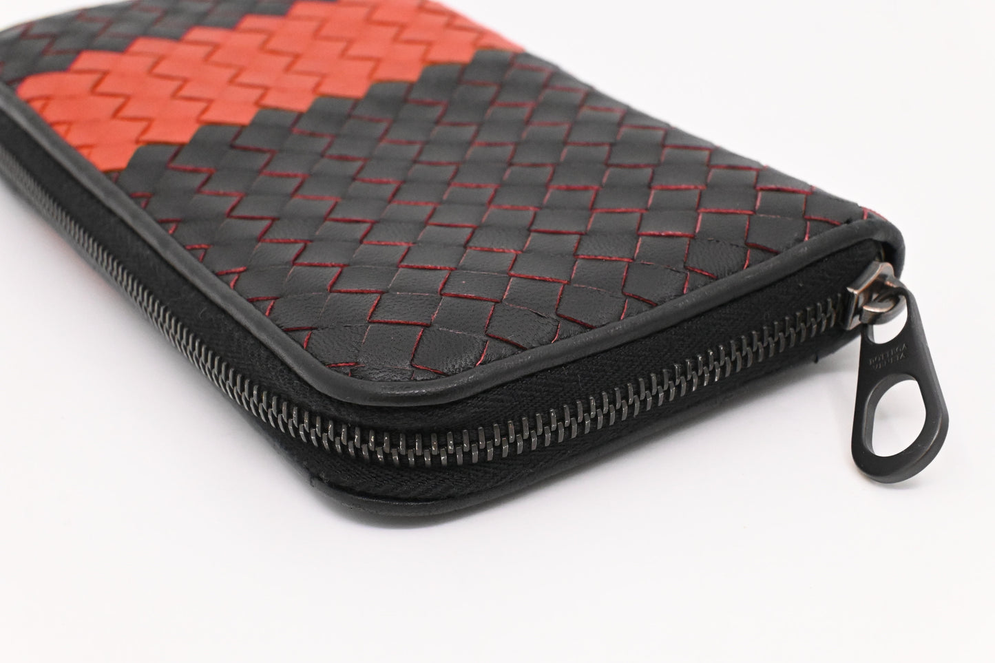 Bottega Veneta Zippy Wallet in Black and Orange Intrecciato Leather
