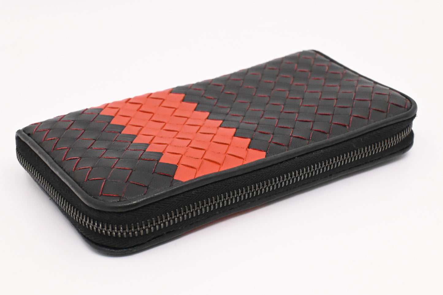 Bottega Veneta Zippy Wallet in Black and Orange Intrecciato Leather
