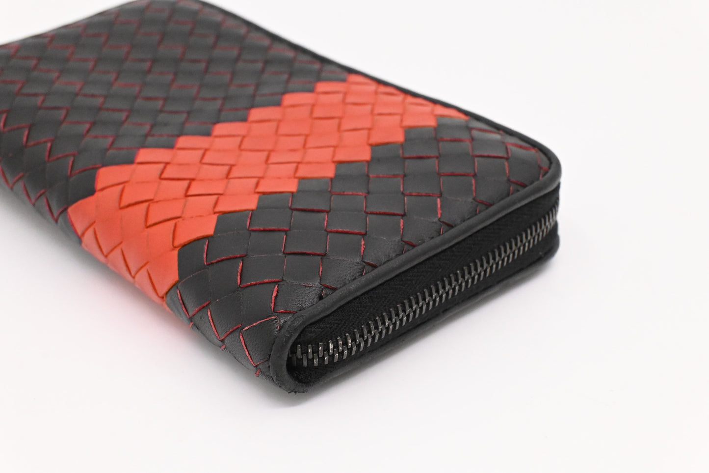 Bottega Veneta Zippy Wallet in Black and Orange Intrecciato Leather