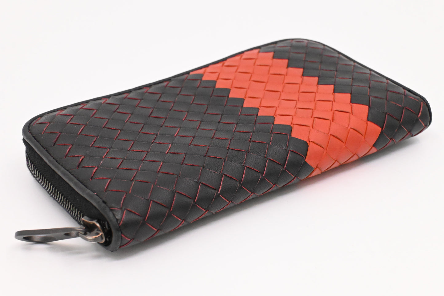 Bottega Veneta Zippy Wallet in Black and Orange Intrecciato Leather