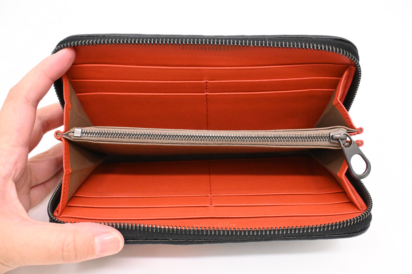 Bottega Veneta Zippy Wallet in Black and Orange Intrecciato Leather