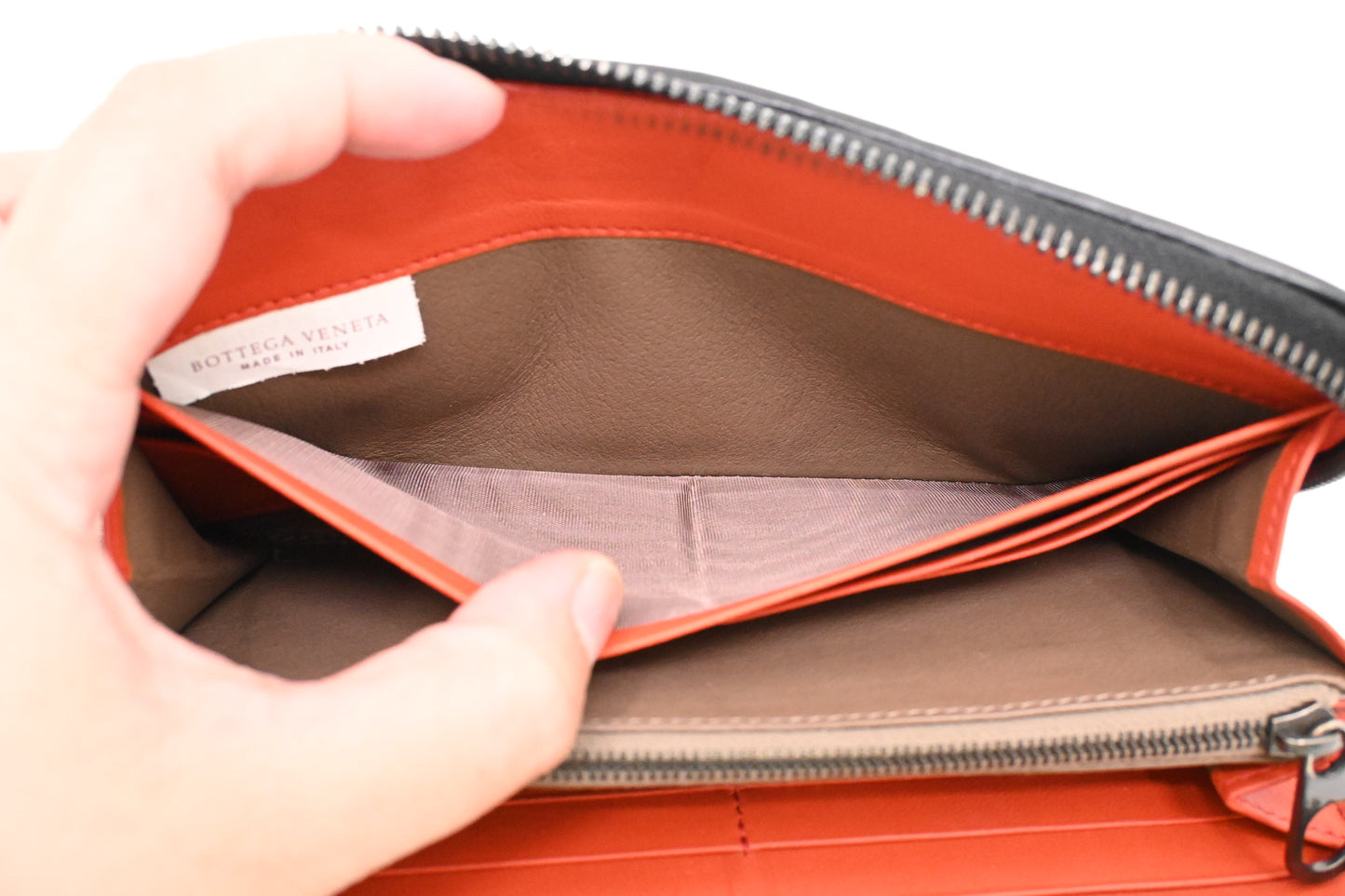 Bottega Veneta Zippy Wallet in Black and Orange Intrecciato Leather