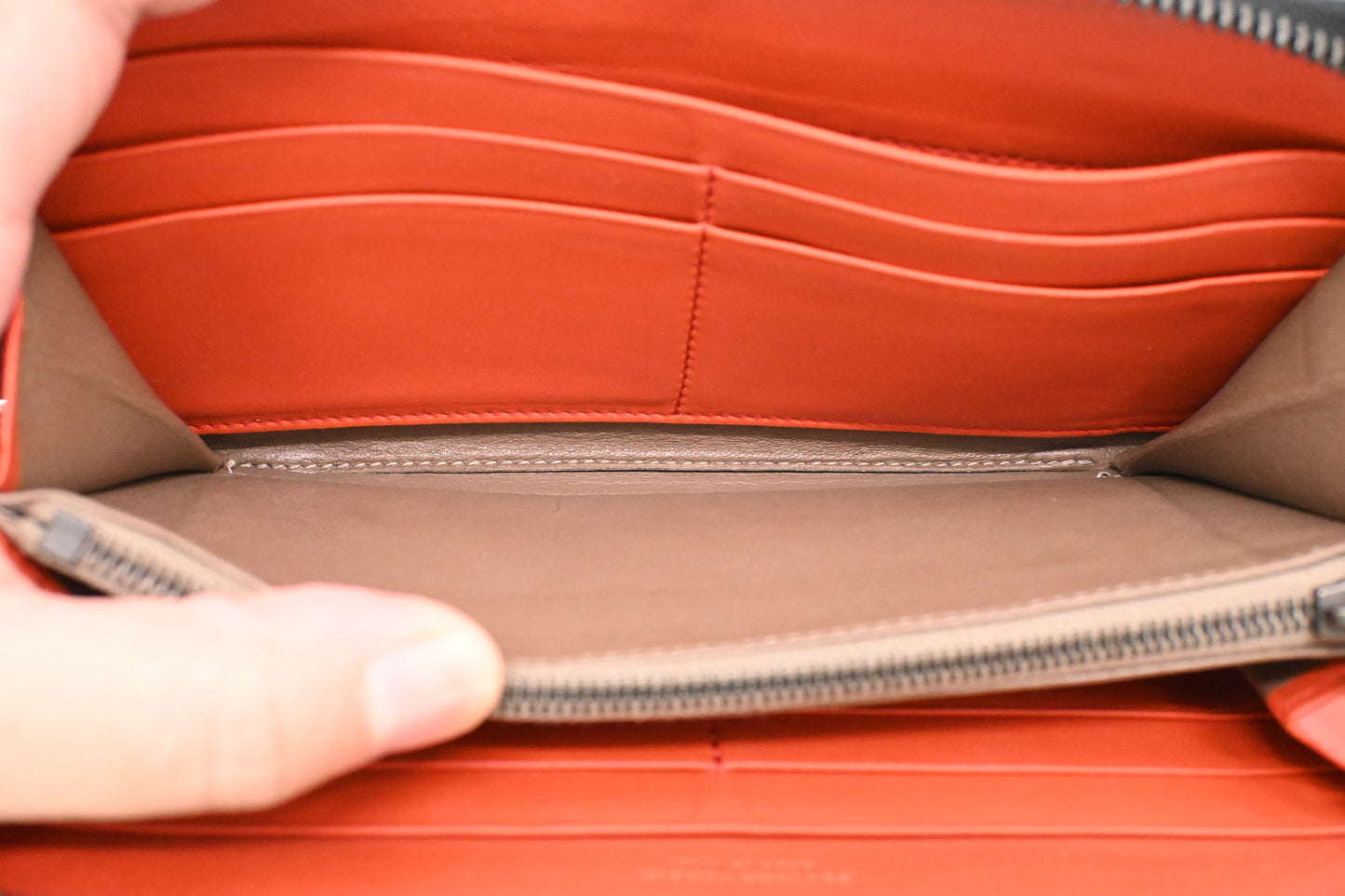 Bottega Veneta Zippy Wallet in Black and Orange Intrecciato Leather