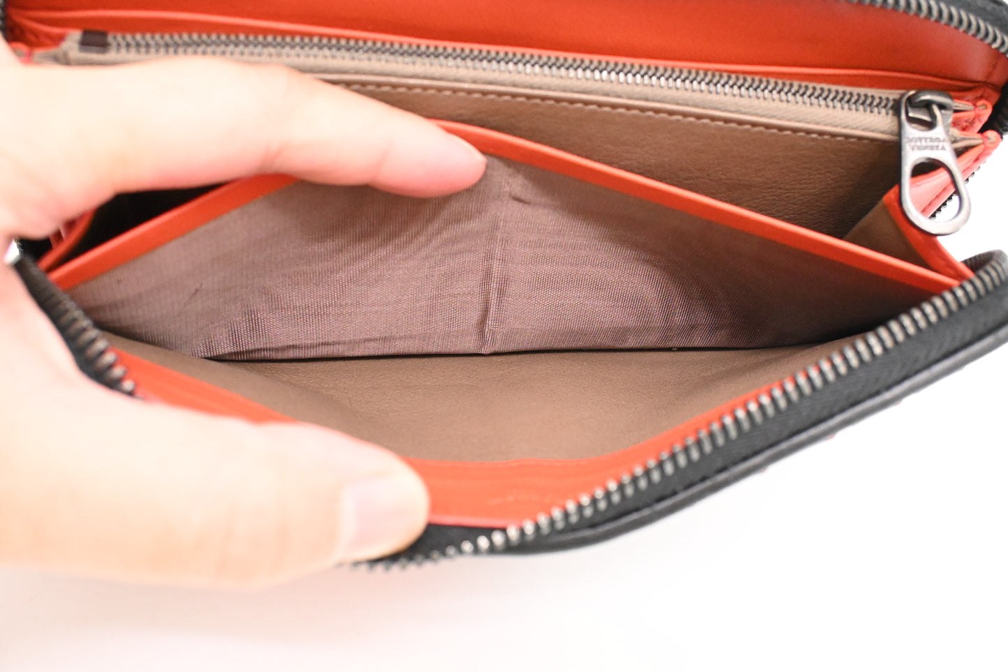 Bottega Veneta Zippy Wallet in Black and Orange Intrecciato Leather