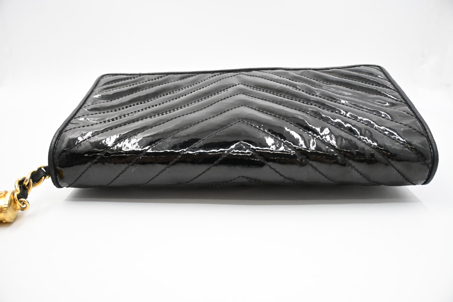 Chanel Chevron Clutch in Black Patent Leather