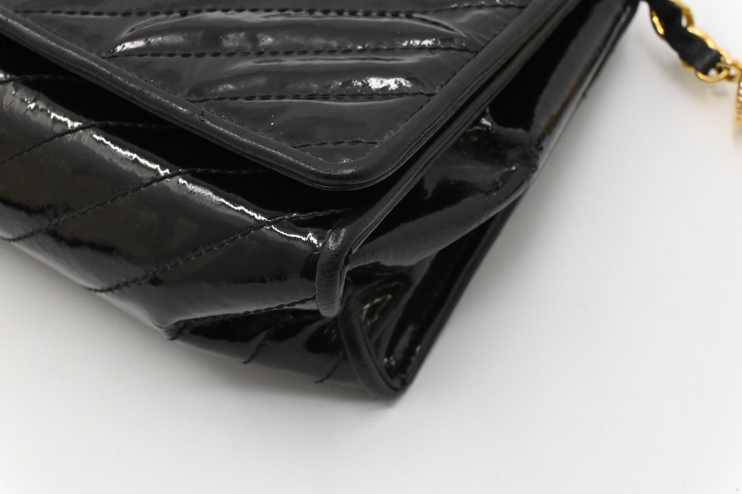 Chanel Chevron Clutch in Black Patent Leather