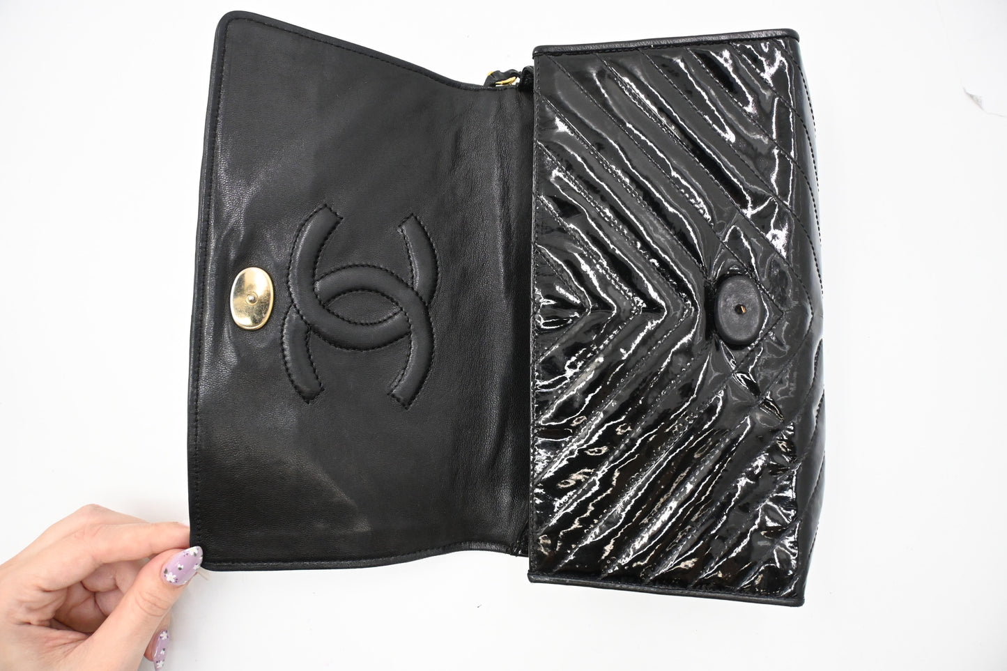 Chanel Chevron Clutch in Black Patent Leather