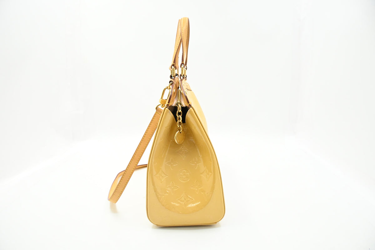 Louis Vuitton Brea MM in Yellow Vernis Leather