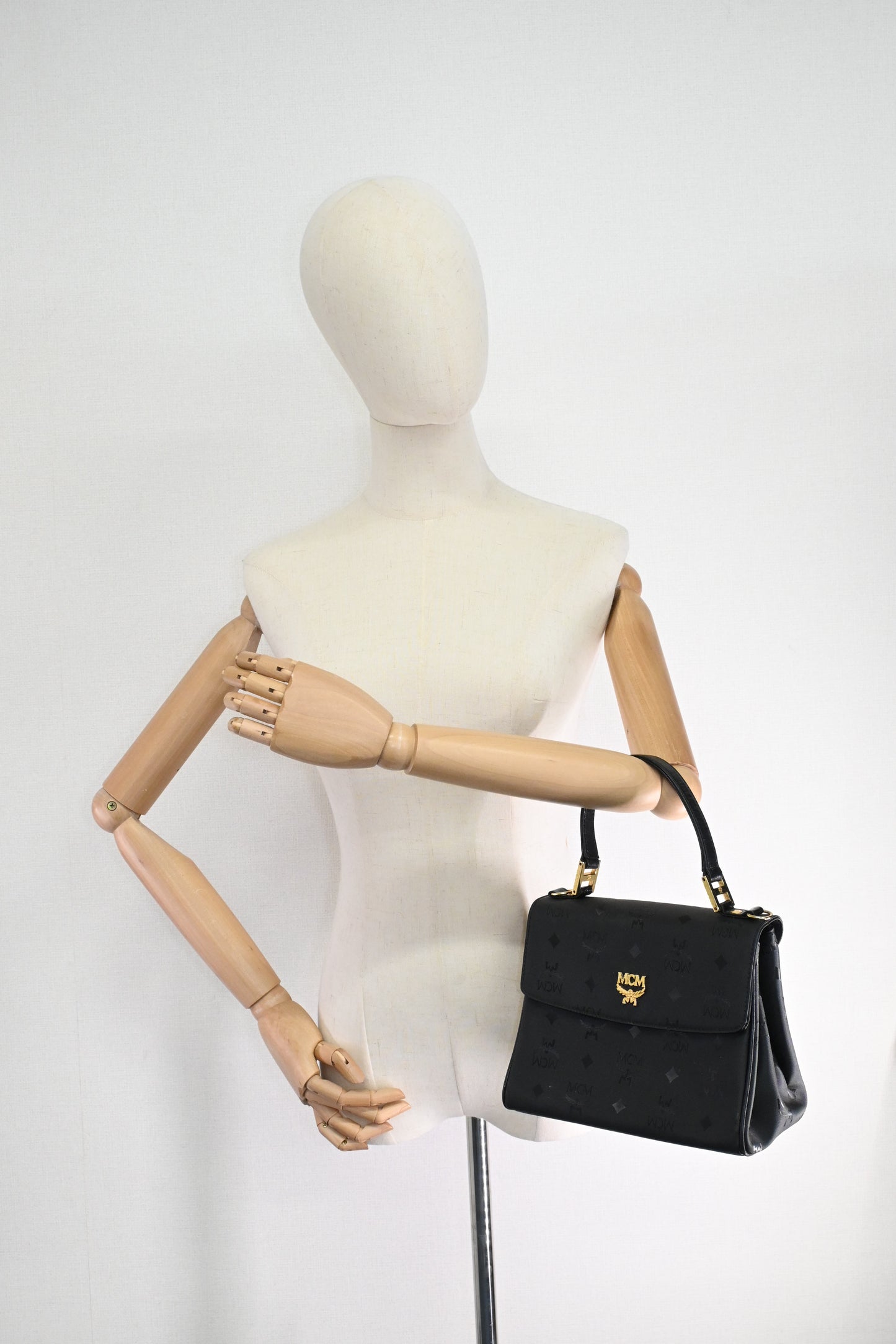 MCM Top Handle Bag in Black Coated Canvas