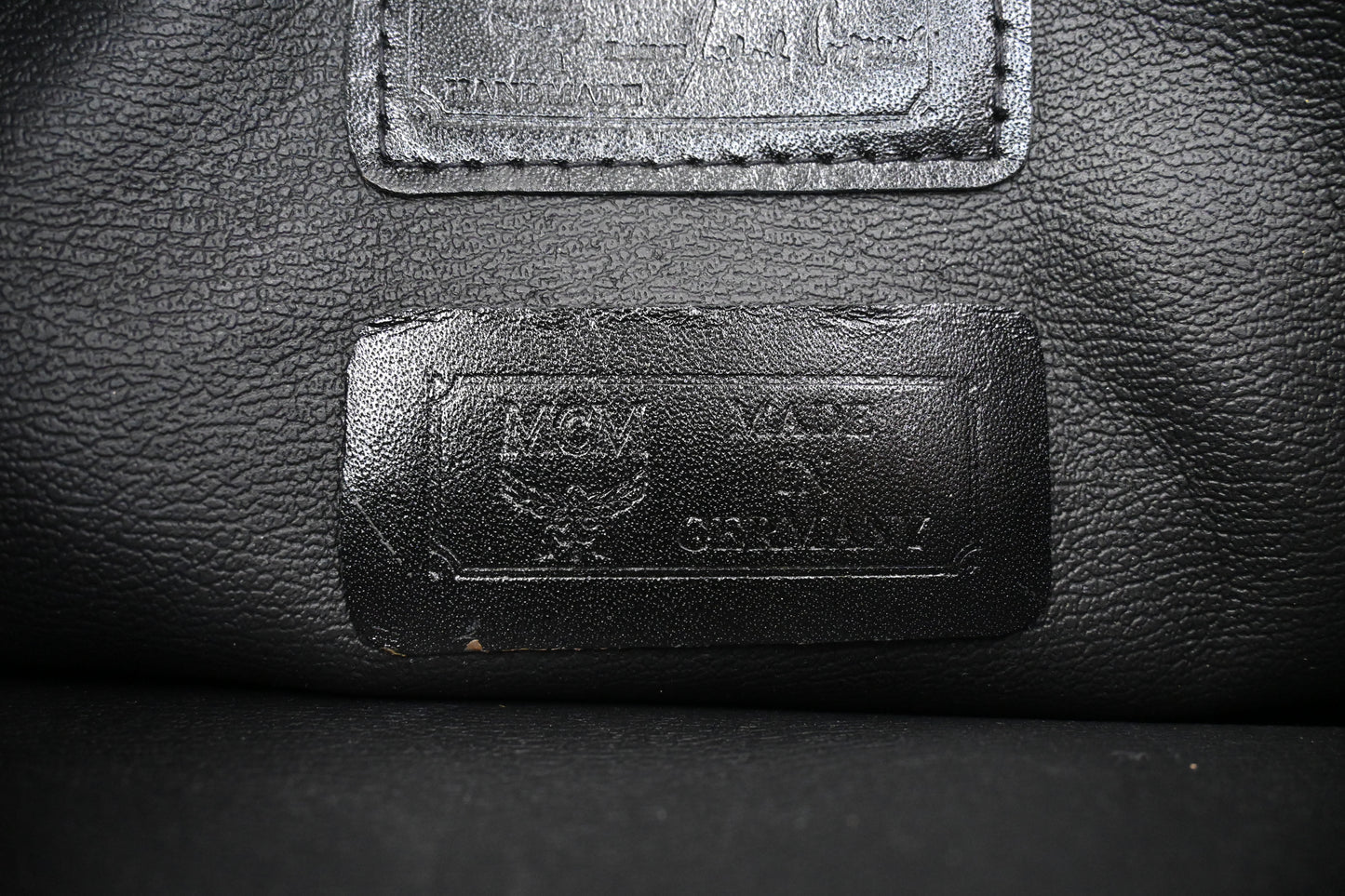 MCM Top Handle Bag in Black Coated Canvas