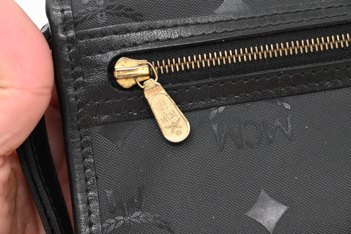 MCM Clutch Bag in Black Visetos Canvas