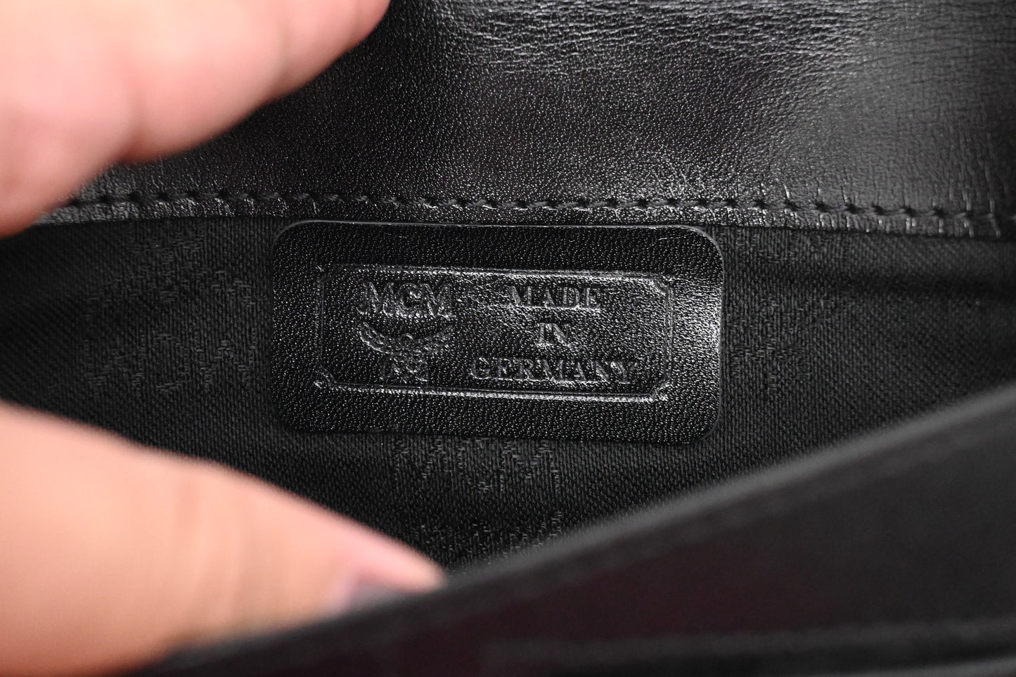 MCM Clutch Bag in Black Visetos Canvas