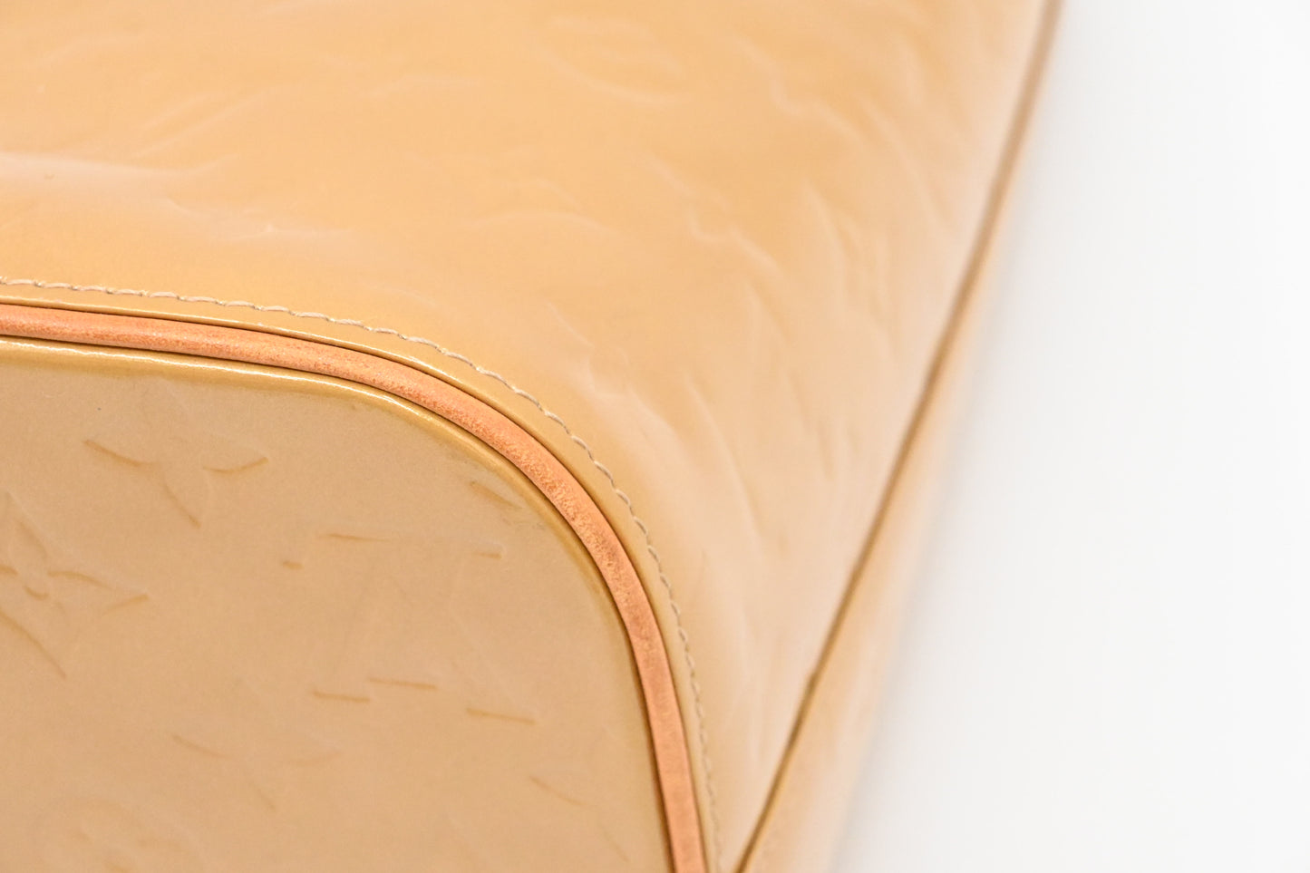 Louis Vuitton Houston in Beige Vernis Leather