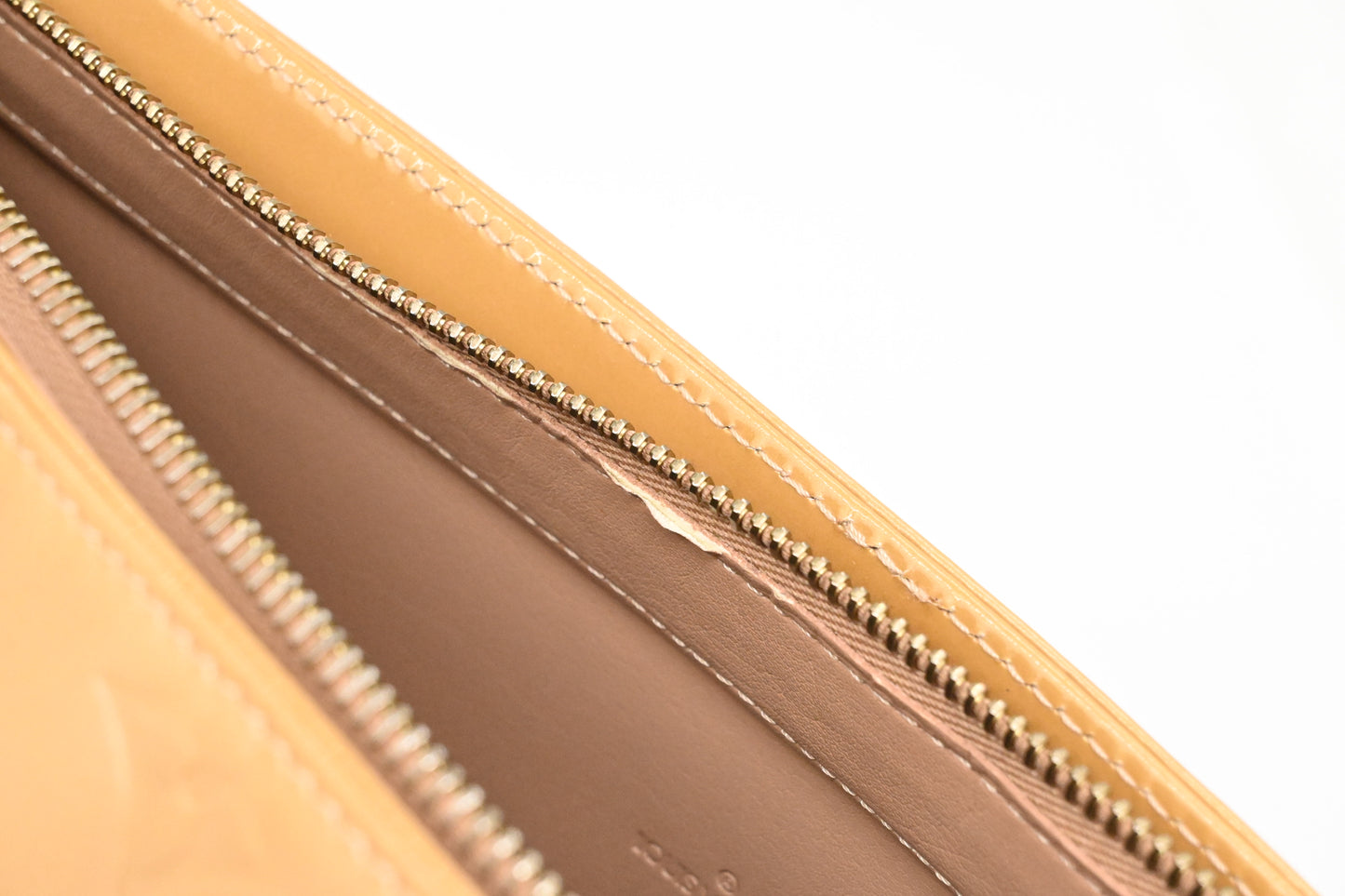 Louis Vuitton Houston in Beige Vernis Leather