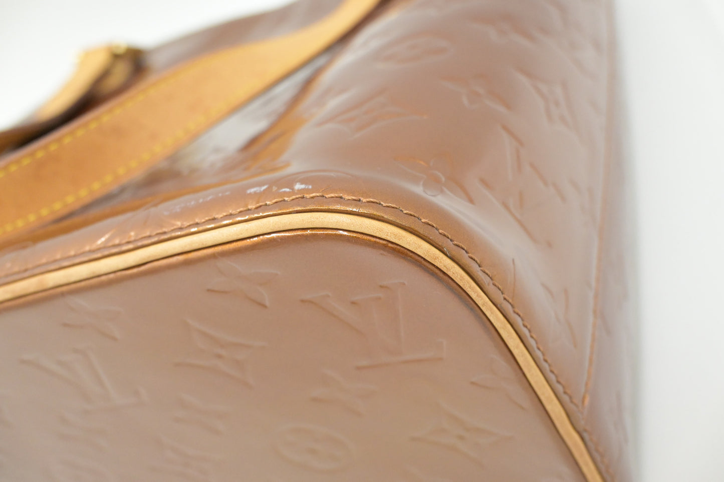 Louis Vuitton Houston in Bronze Vernis Leather