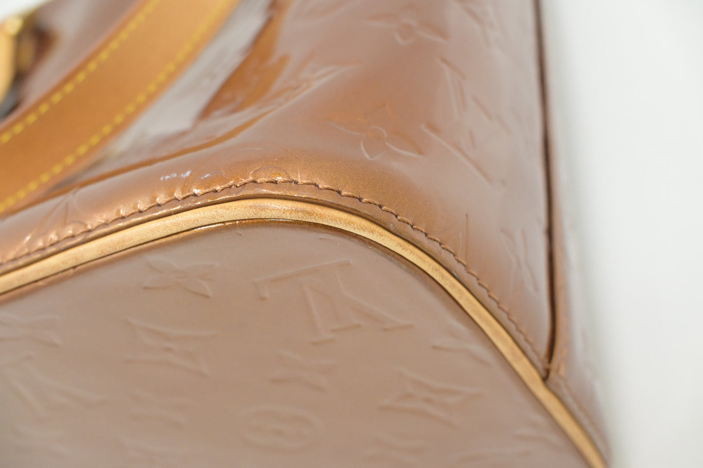 Louis Vuitton Houston in Bronze Vernis Leather