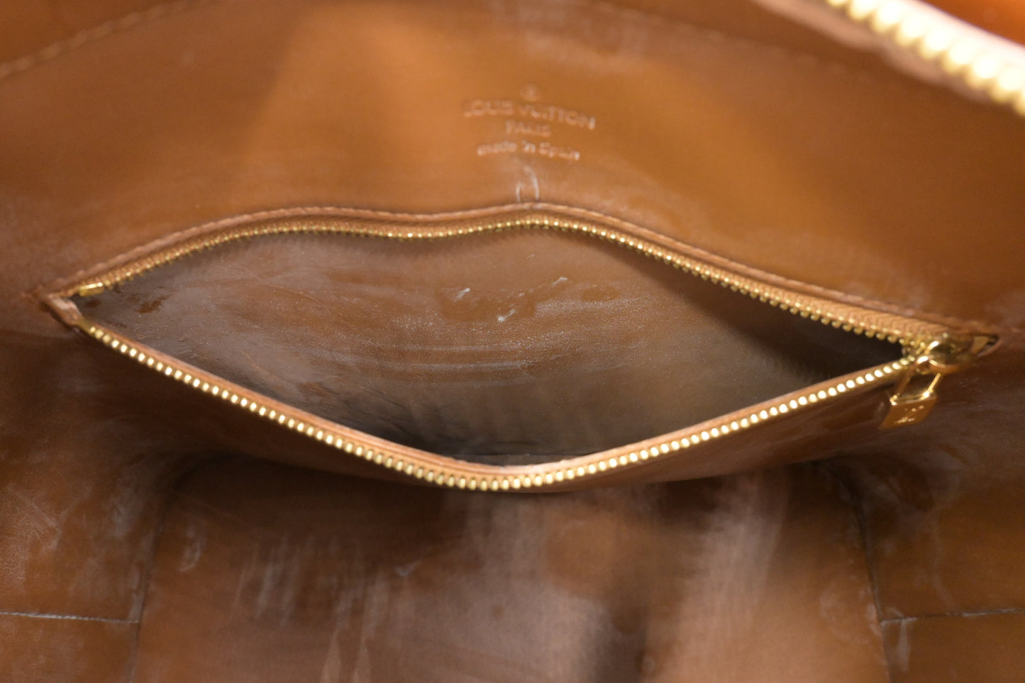 Louis Vuitton Houston in Bronze Vernis Leather