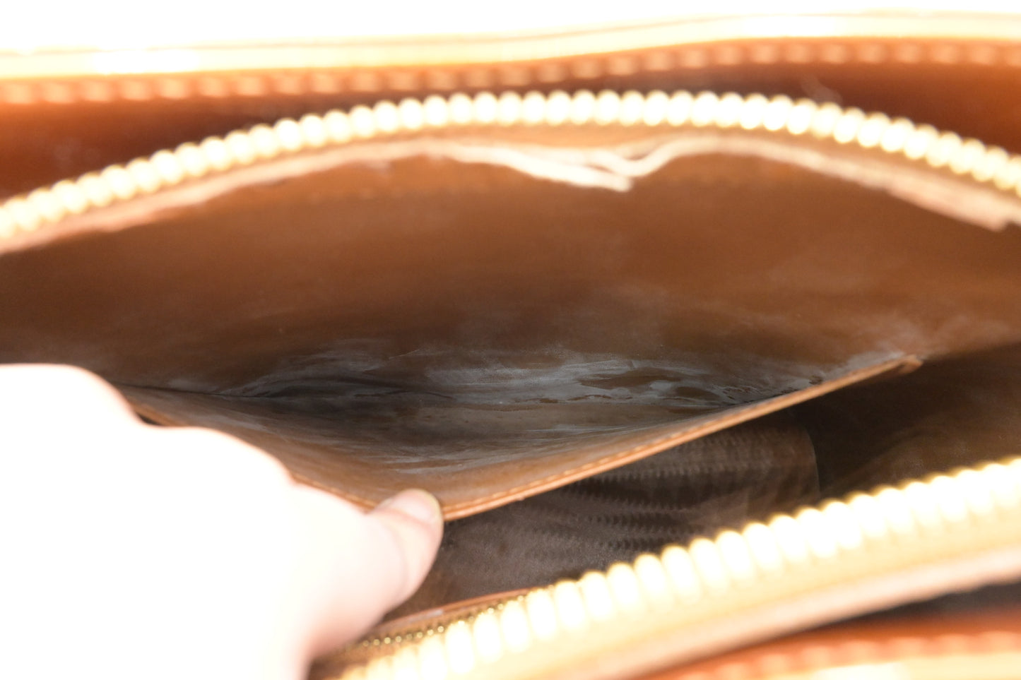 Louis Vuitton Houston in Bronze Vernis Leather