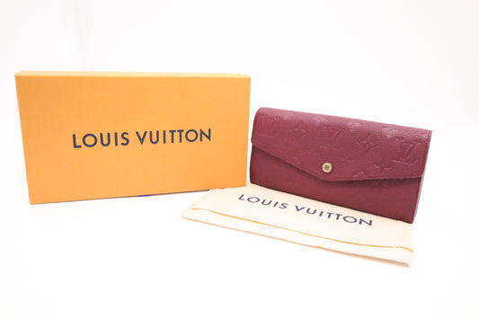 Louis Vuitton Sarah Wallet in Aurore Empreinte Leather
