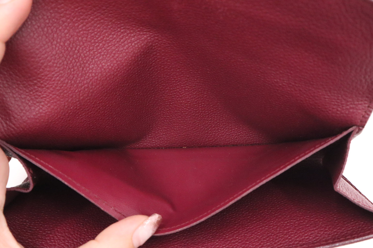 Louis Vuitton Sarah Wallet in Aurore Empreinte Leather