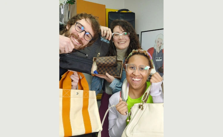 Sellers Clement, Bridget, and Camila holding bags